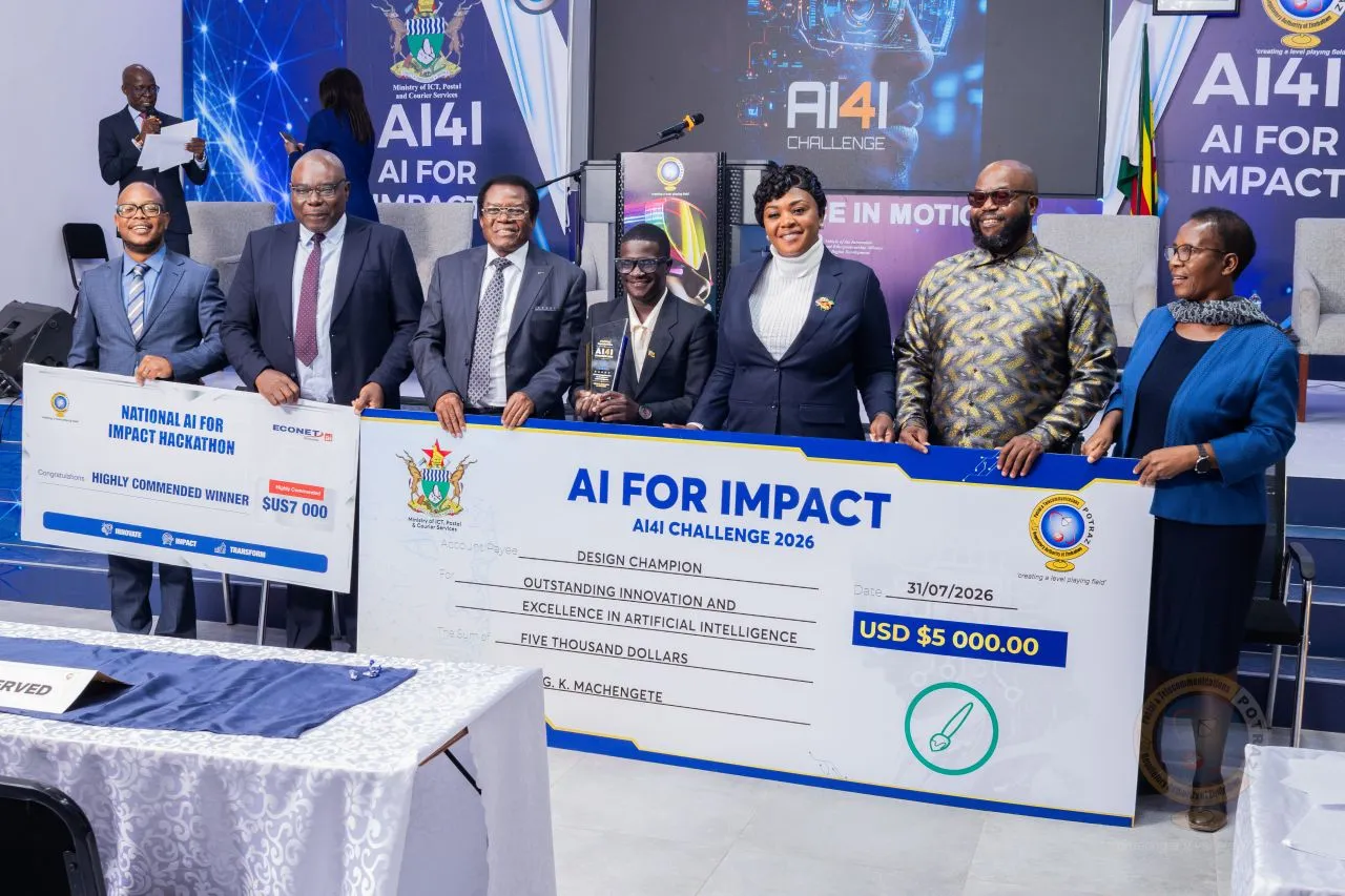 Holding the $12,000 cheques from Econet Wireless and His Excellency